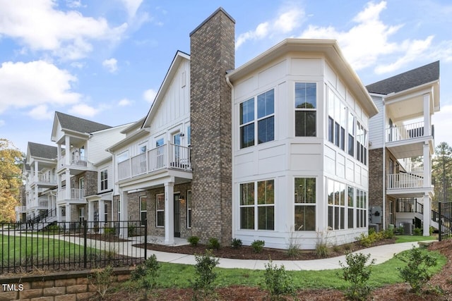 view of home's exterior with a yard and central AC unit