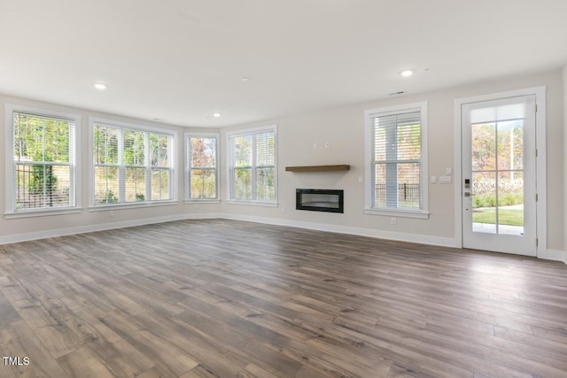 unfurnished living room featuring wood-type flooring