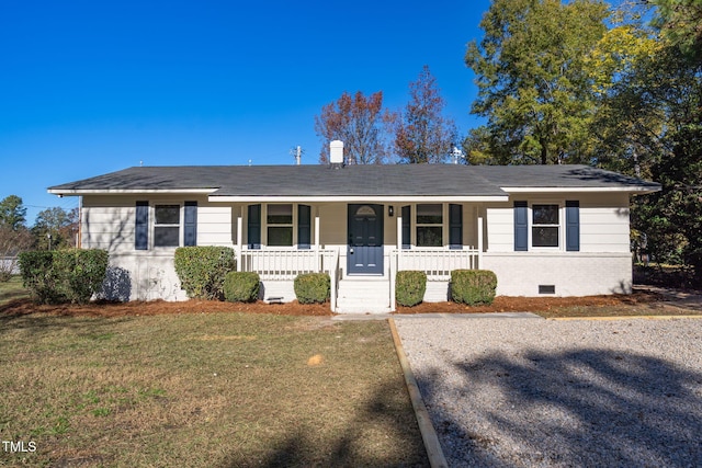 ranch-style home with covered porch and a front yard