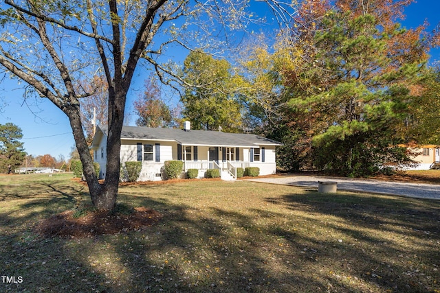 view of front of house with a front yard and a porch