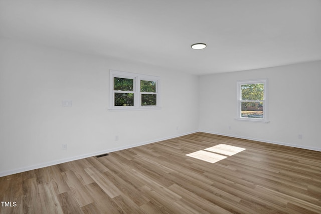 unfurnished room featuring light wood-type flooring