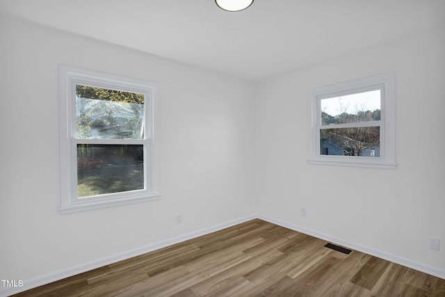 spare room featuring hardwood / wood-style floors