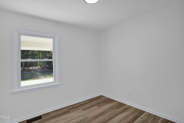 unfurnished room featuring hardwood / wood-style floors