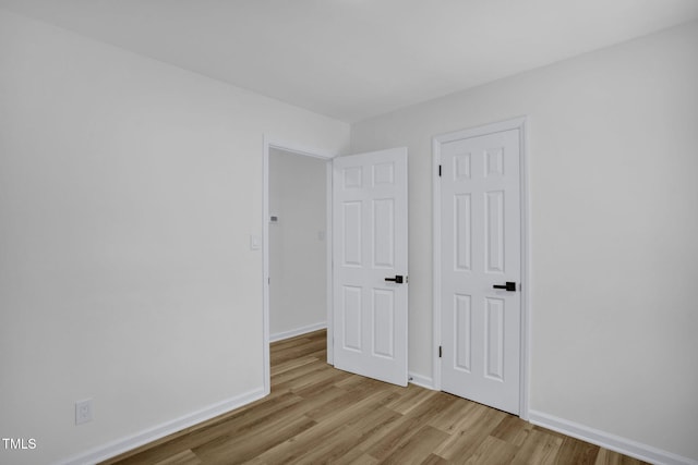 empty room with light wood-type flooring