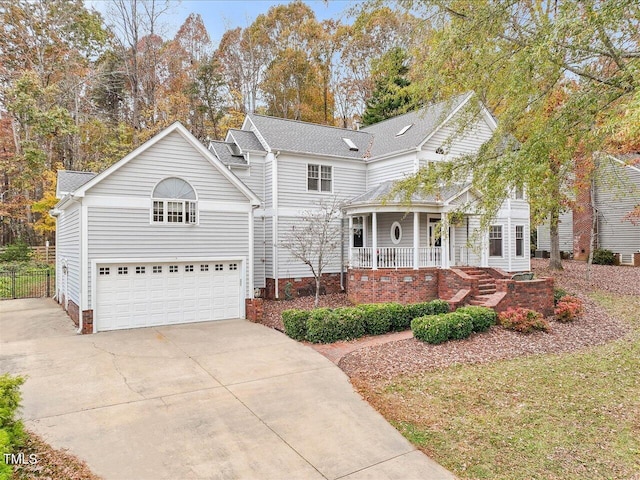 front facade featuring a porch and a garage