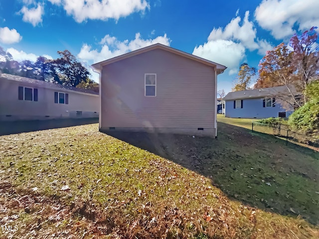 view of home's exterior featuring a lawn