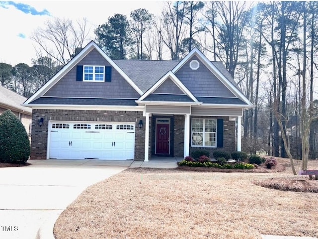 craftsman-style home featuring concrete driveway, brick siding, and an attached garage