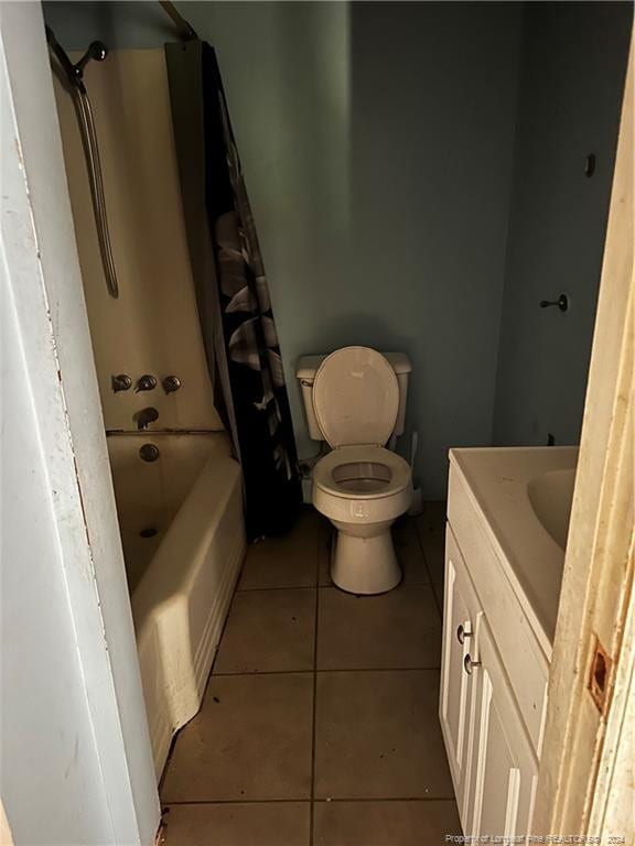 full bathroom with shower / tub combination, tile patterned flooring, vanity, and toilet