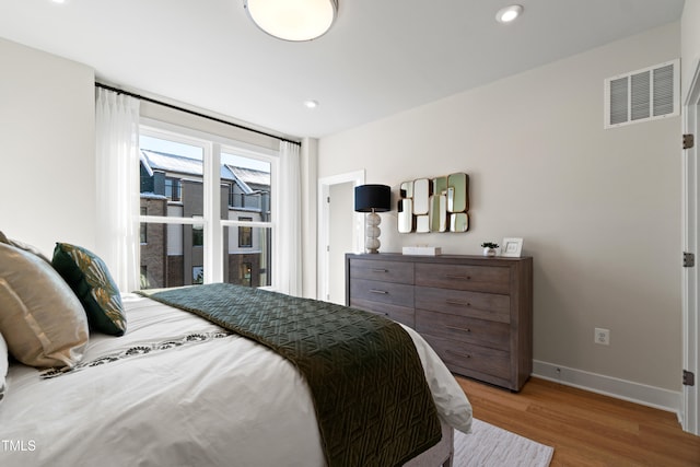 bedroom featuring wood-type flooring