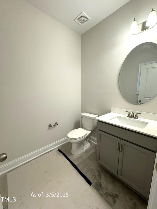 half bathroom featuring toilet, baseboards, visible vents, and vanity