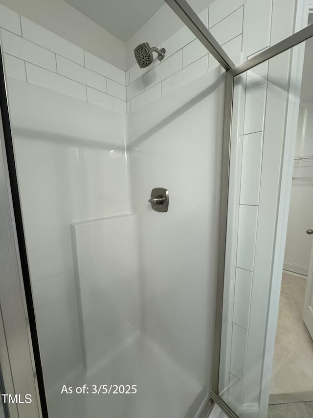 bathroom with a shower stall