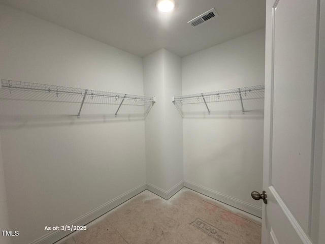 walk in closet featuring visible vents