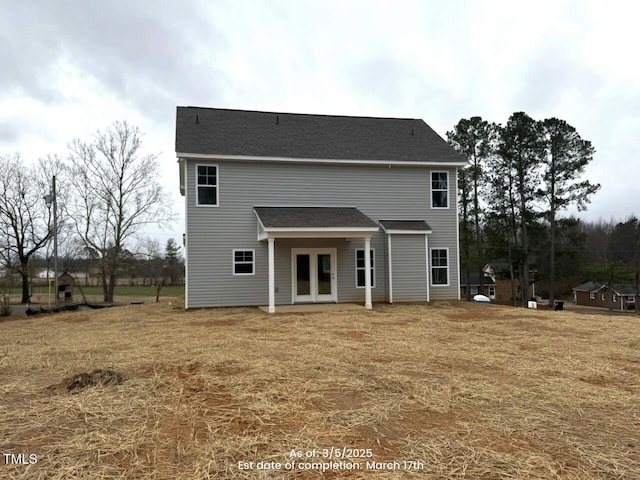 rear view of property featuring french doors