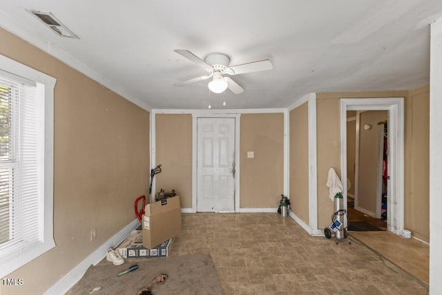 interior space featuring ceiling fan