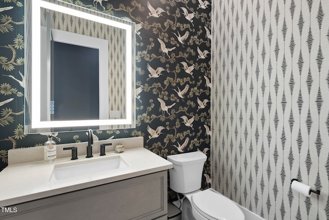 bathroom with vanity and toilet