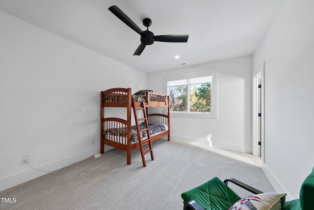 bedroom featuring ceiling fan and light colored carpet