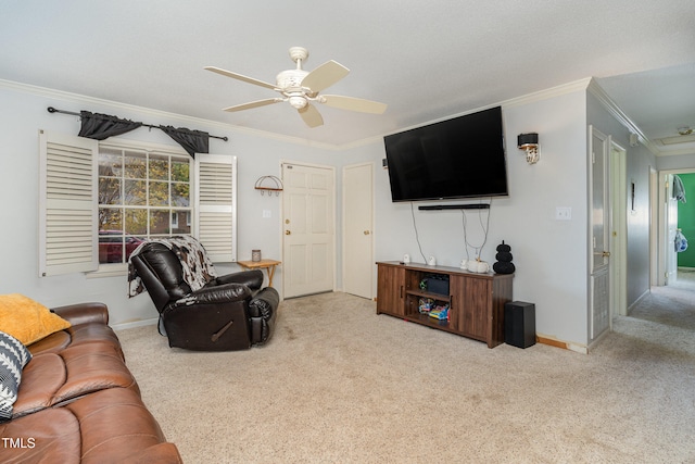 living room featuring crown molding, ceiling fan, and light colored carpet