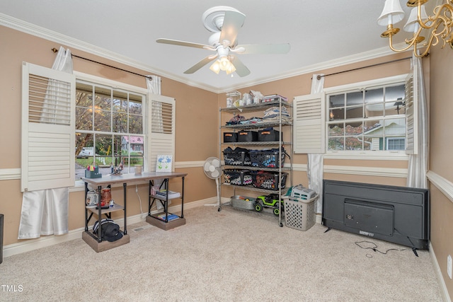 carpeted office with ceiling fan with notable chandelier and ornamental molding