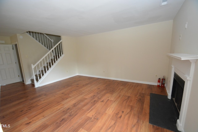 unfurnished living room featuring hardwood / wood-style floors