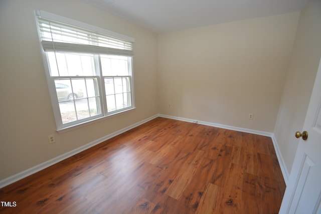 empty room featuring dark hardwood / wood-style flooring