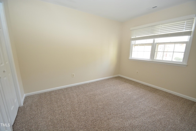 unfurnished room with carpet flooring