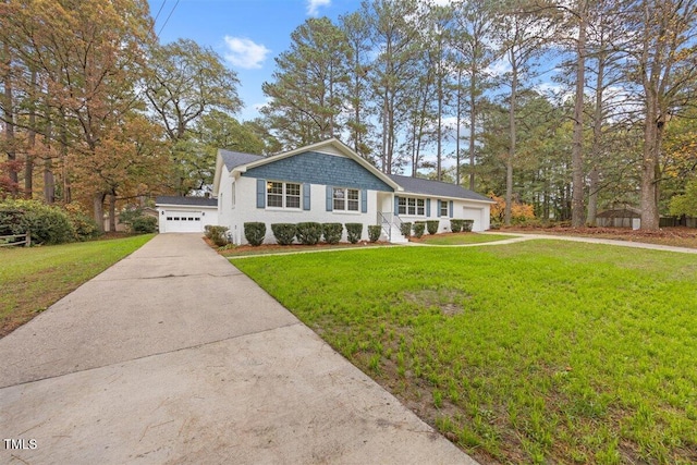 view of front of house featuring a front yard and a garage