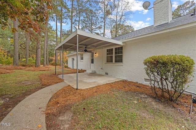 exterior space with ceiling fan