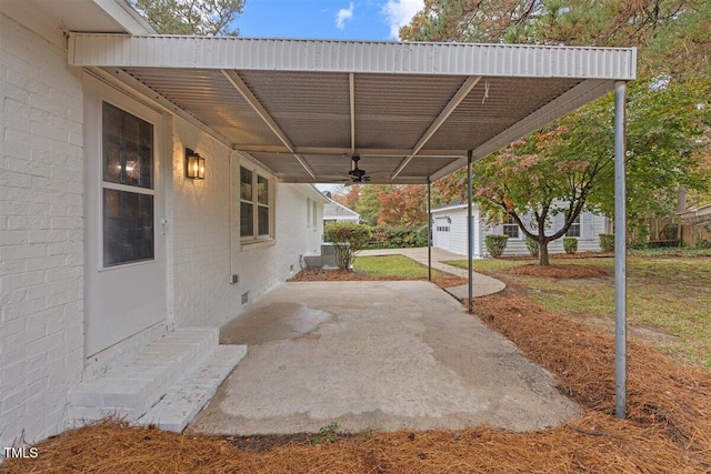 view of patio / terrace featuring ceiling fan and an outdoor structure