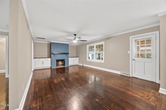 unfurnished living room with a fireplace, ceiling fan, dark hardwood / wood-style flooring, and ornamental molding