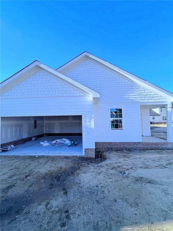 view of side of property with a garage