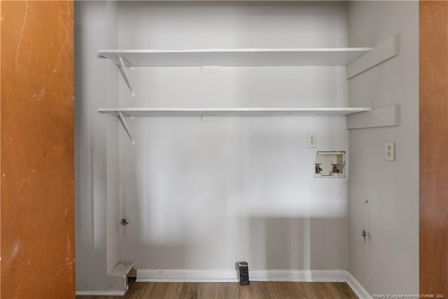 clothes washing area with washer hookup and hardwood / wood-style flooring