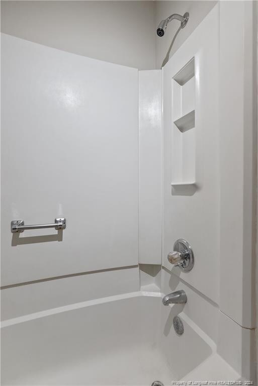 bathroom featuring washtub / shower combination