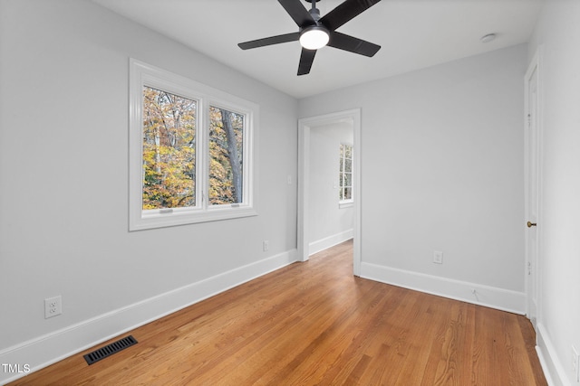 spare room with ceiling fan and light hardwood / wood-style floors