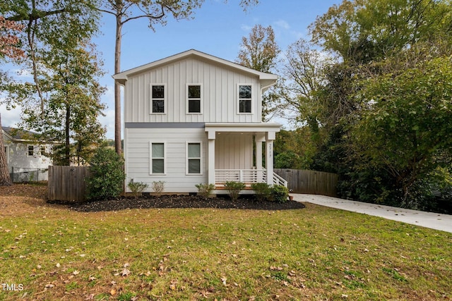 view of front of property with a front yard and covered porch