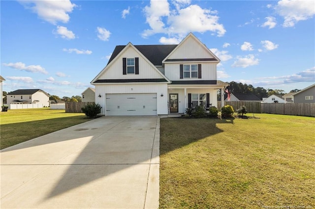 view of front of property featuring a garage and a front lawn