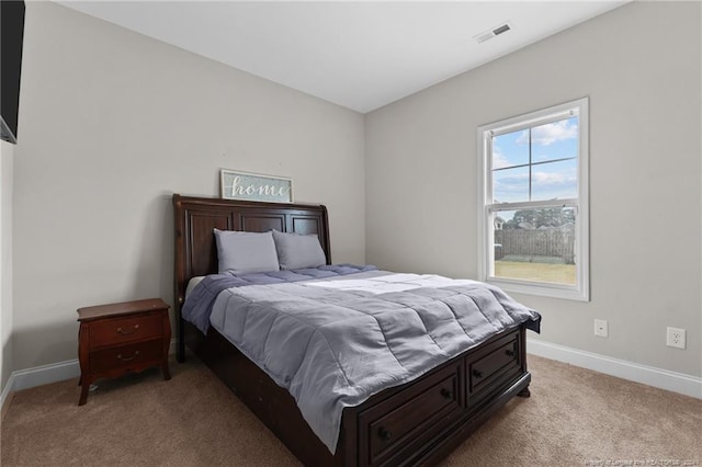 bedroom featuring light carpet