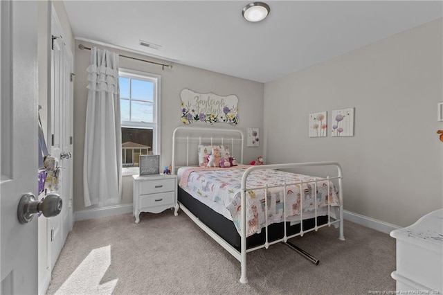 bedroom featuring light carpet