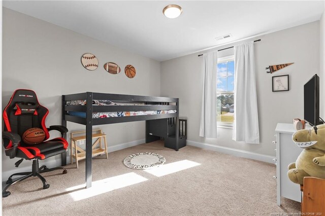 bedroom with light carpet