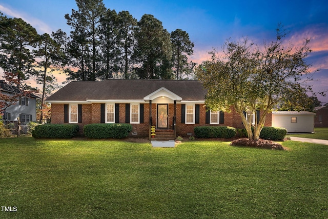 ranch-style house with a yard