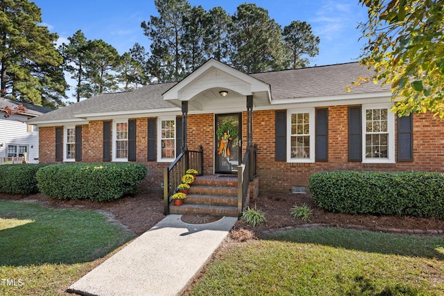 single story home featuring a front lawn