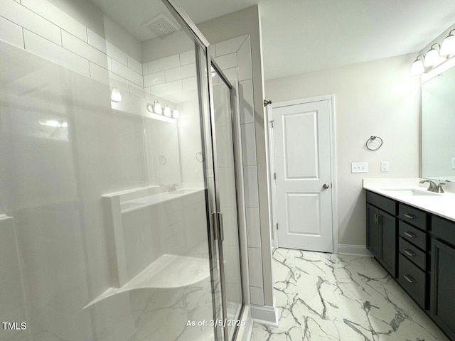 full bathroom featuring marble finish floor, visible vents, a shower stall, vanity, and baseboards