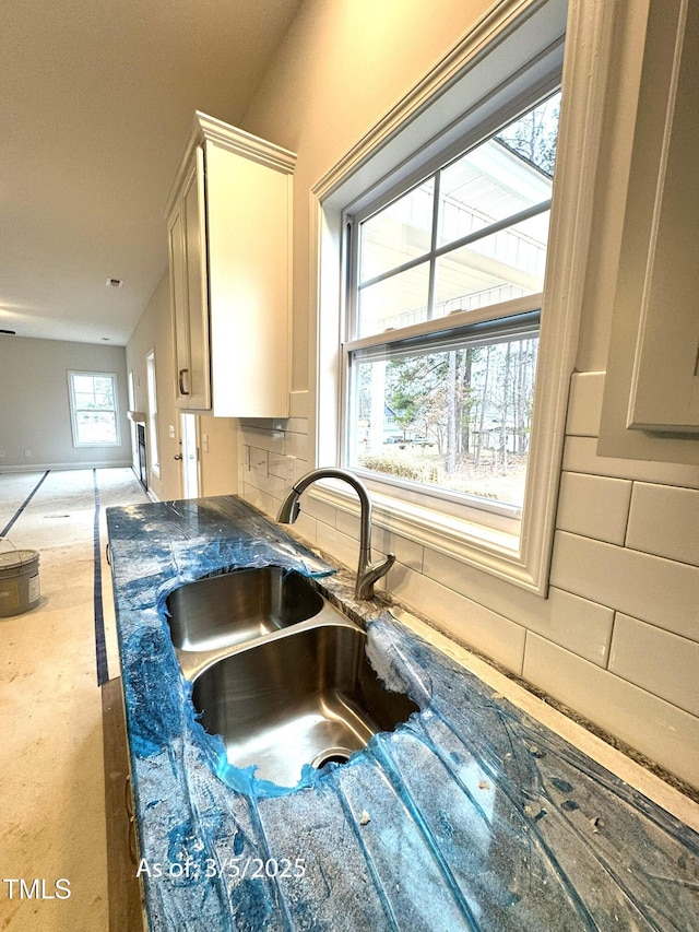 kitchen featuring tasteful backsplash and a sink