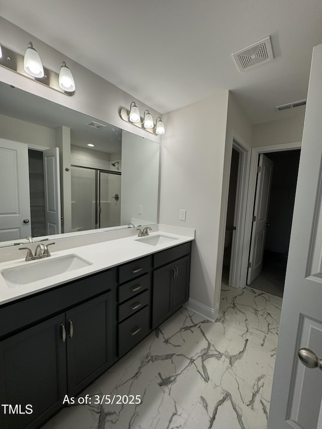 full bath featuring a sink, visible vents, and a shower stall