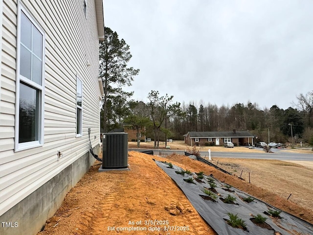 view of yard featuring central AC unit