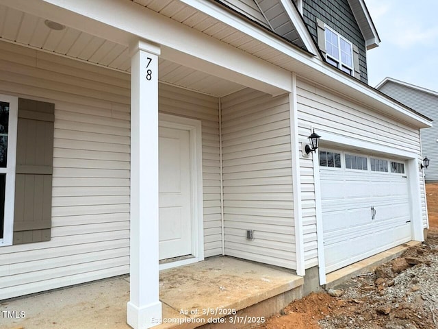 doorway to property featuring an attached garage