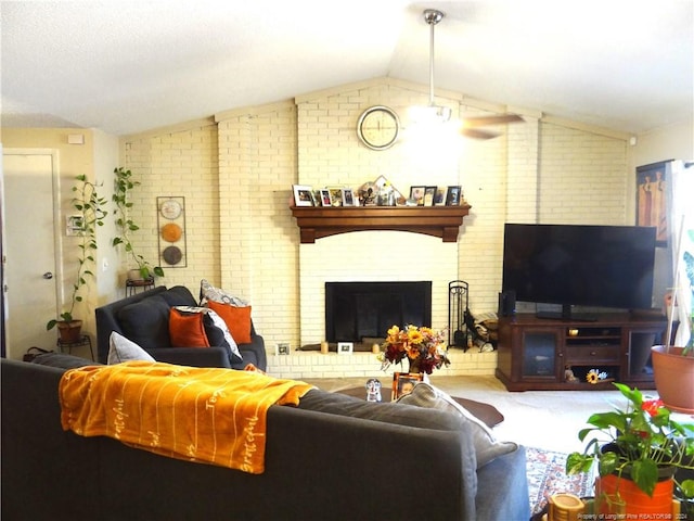 living room featuring lofted ceiling and brick wall