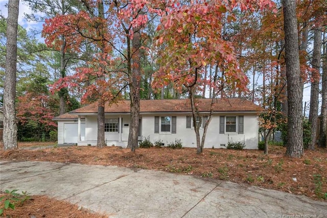 ranch-style home with a garage