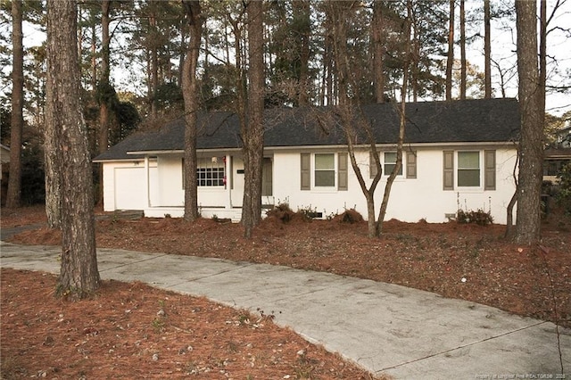 ranch-style home with a garage