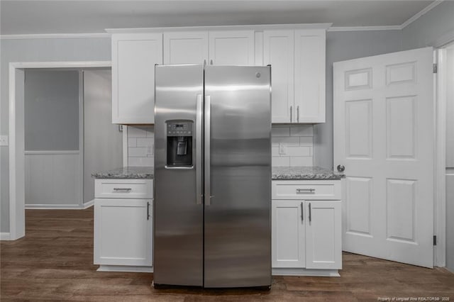 kitchen featuring white cabinetry, stainless steel refrigerator with ice dispenser, and light stone counters