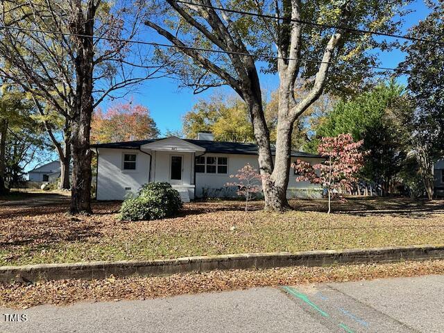 445 N Dunn St, Angier, NC 27501 - ranch-style home with a chimney